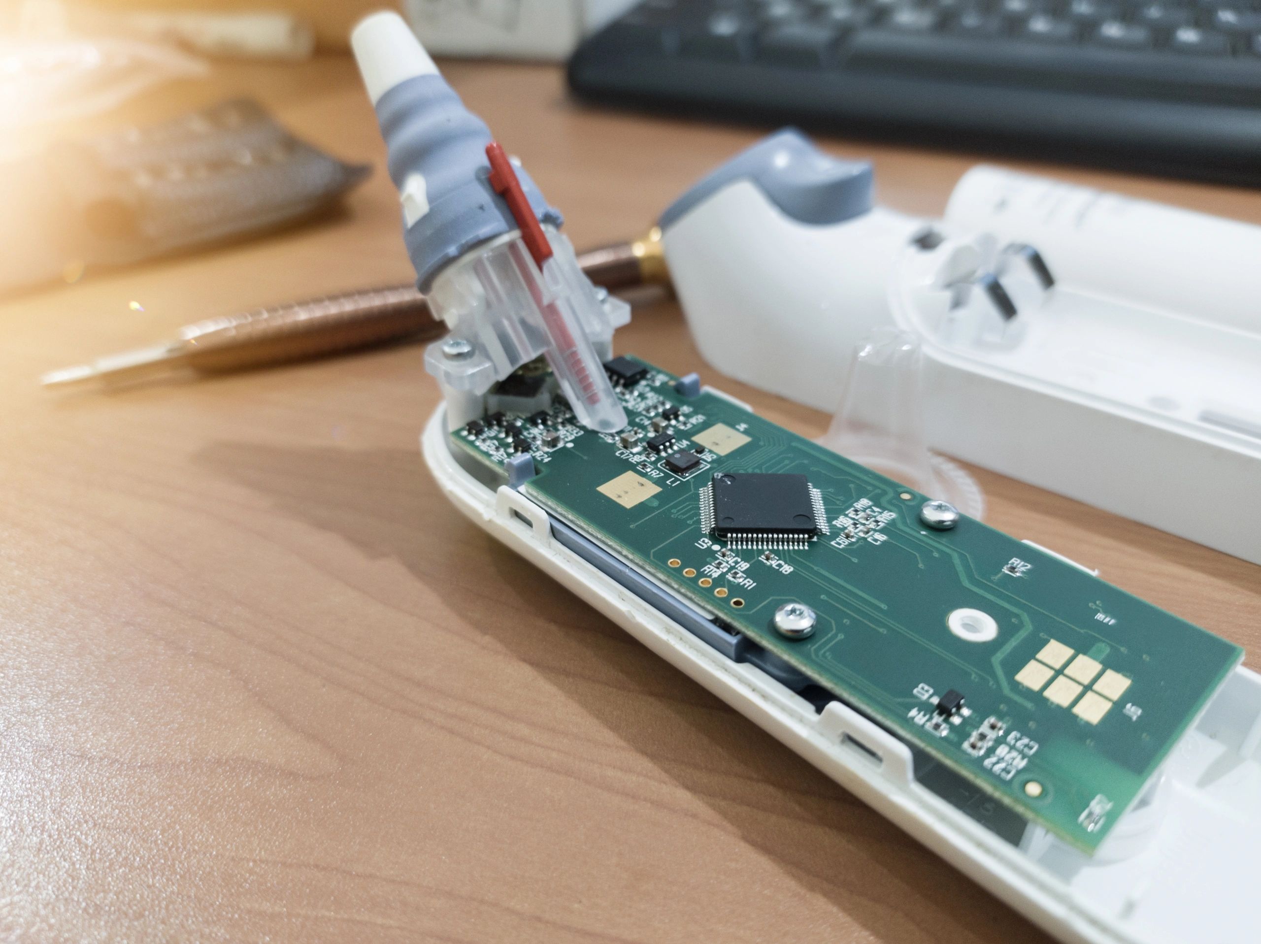 Close-up of embedded electronics testing for a medical device